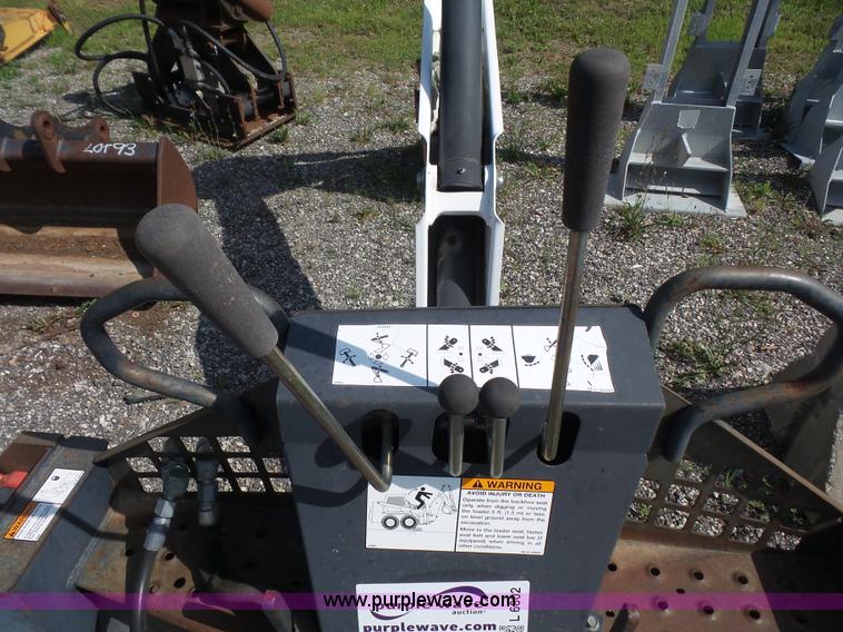 image for item L6802 Bobcat 8811 backhoe skid steer attachment