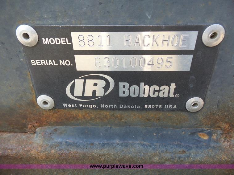 image for item L6802 Bobcat 8811 backhoe skid steer attachment