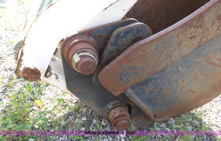 image for item L6802 Bobcat 8811 backhoe skid steer attachment