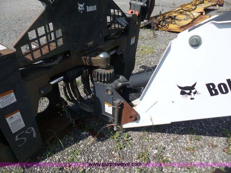 image for item L6802 Bobcat 8811 backhoe skid steer attachment