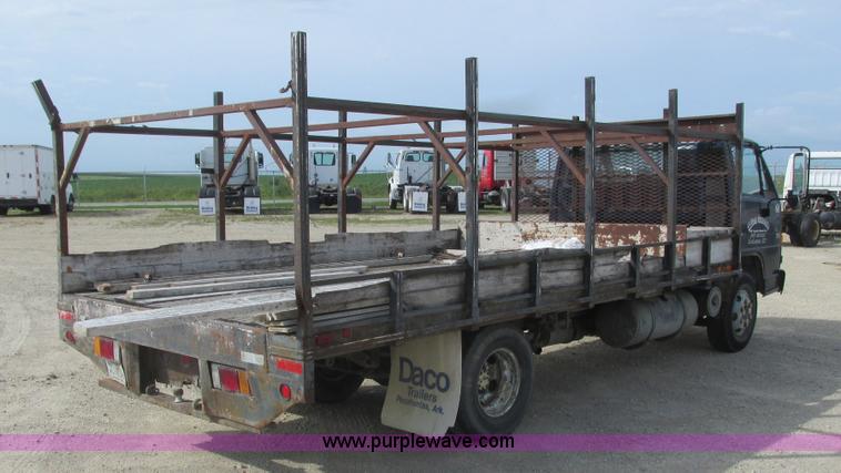 image for item K4057 1990 Isuzu NPR flatbed truck