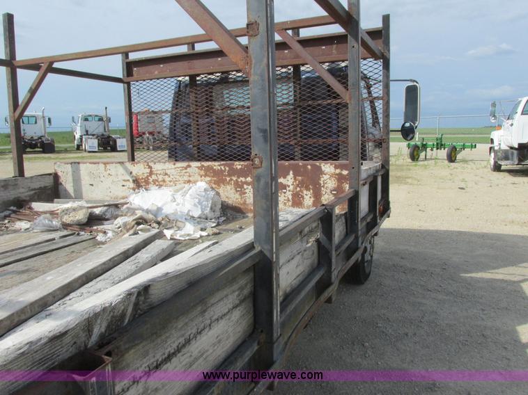 image for item K4057 1990 Isuzu NPR flatbed truck