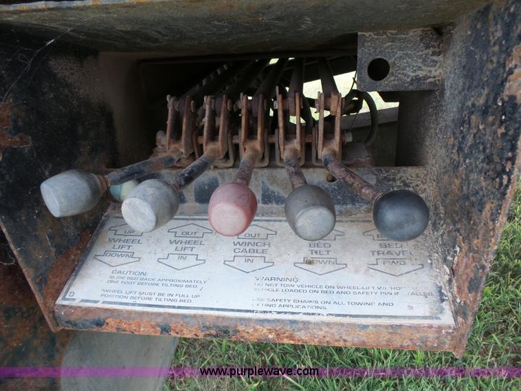 image for item K5304 2000 Freightliner FL60 rollback truck