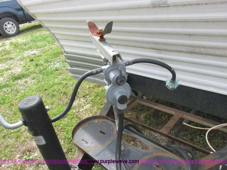 image for item L6198 2005 Sunray Smokey camper