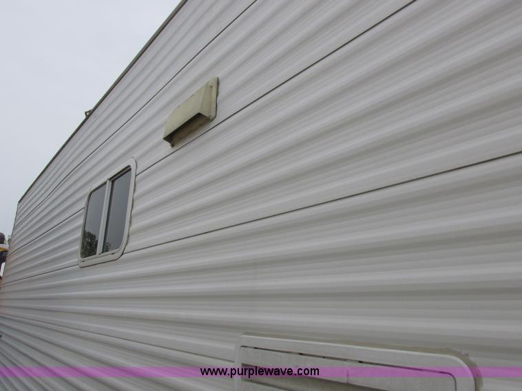 image for item L6198 2005 Sunray Smokey camper