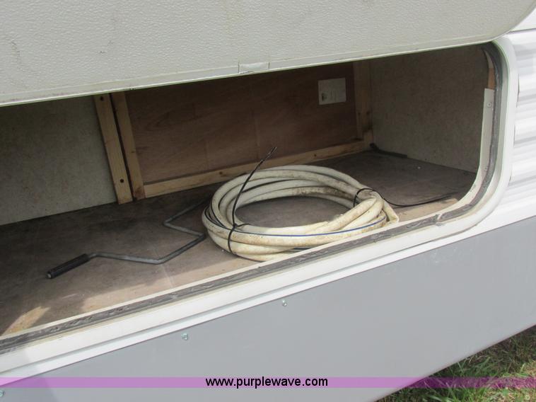 image for item L6198 2005 Sunray Smokey camper