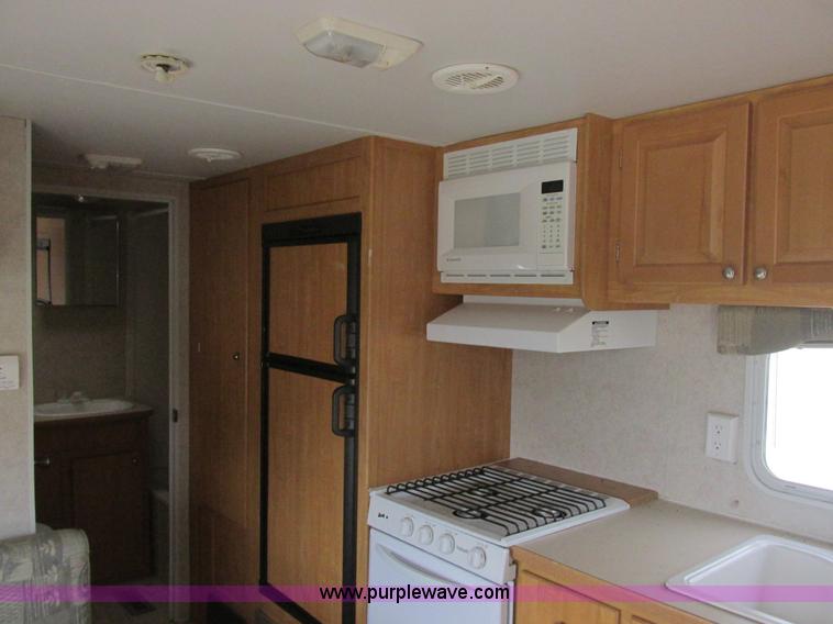 image for item L6198 2005 Sunray Smokey camper