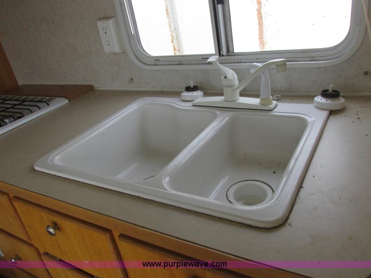 image for item L6198 2005 Sunray Smokey camper