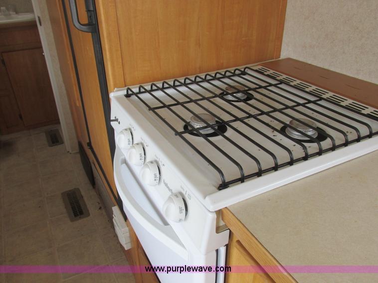 image for item L6198 2005 Sunray Smokey camper