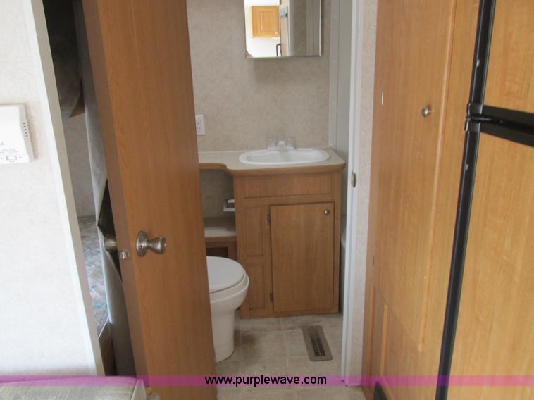 image for item L6198 2005 Sunray Smokey camper