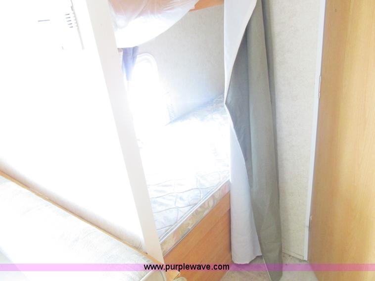 image for item L6198 2005 Sunray Smokey camper