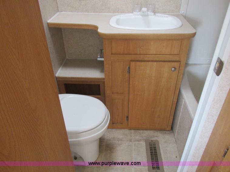 image for item L6198 2005 Sunray Smokey camper