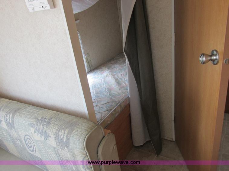 image for item L6198 2005 Sunray Smokey camper