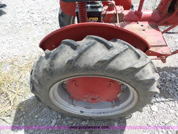 image for item K1671 Mccormick Farmall Cub tractor