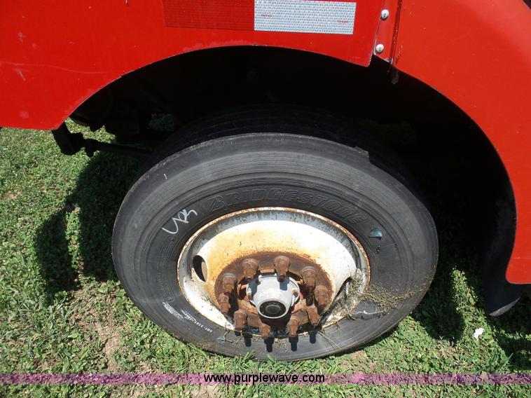 image for item K1708 1999 Volvo WG64 roll-off truck