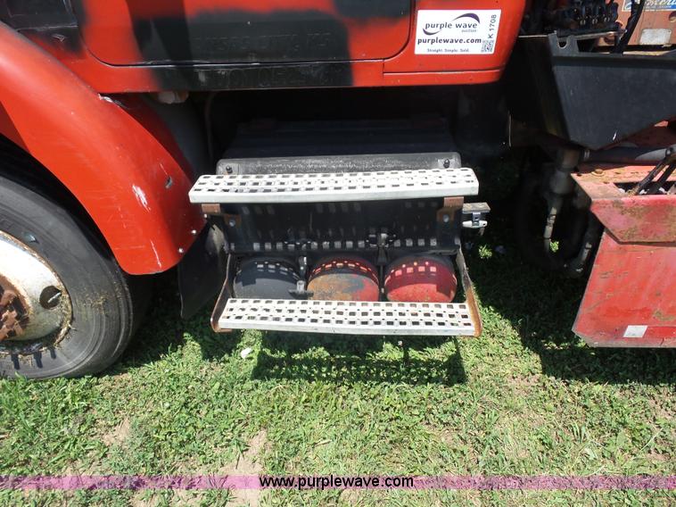 image for item K1708 1999 Volvo WG64 roll-off truck