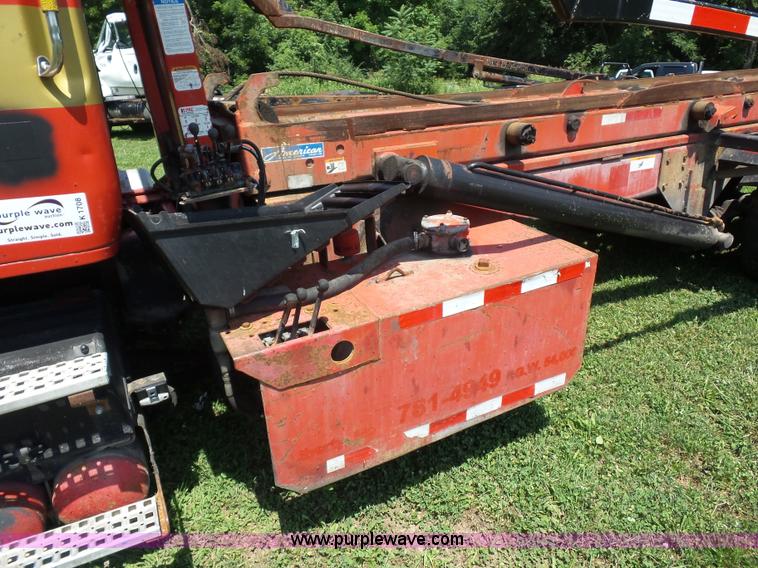 image for item K1708 1999 Volvo WG64 roll-off truck