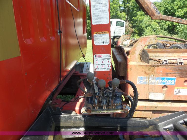 image for item K1708 1999 Volvo WG64 roll-off truck