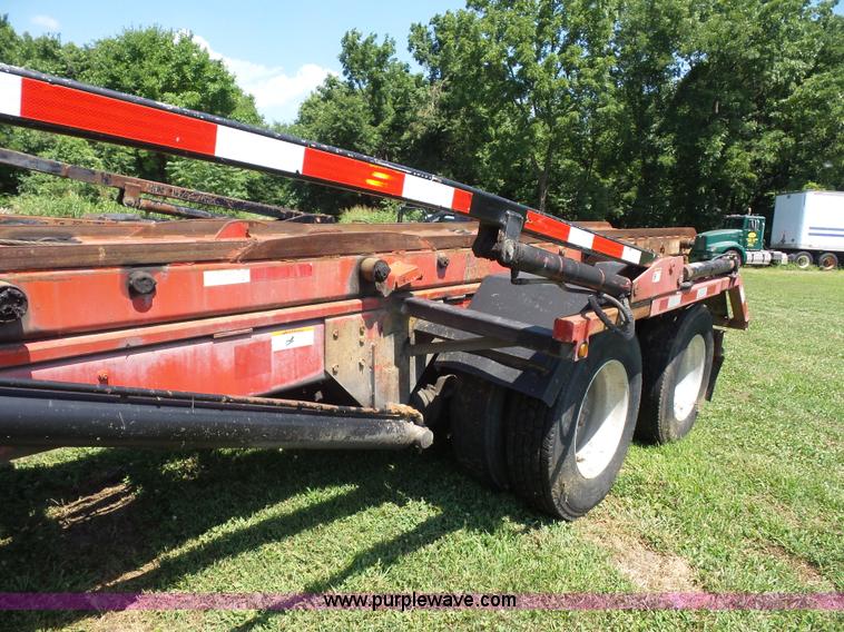 image for item K1708 1999 Volvo WG64 roll-off truck