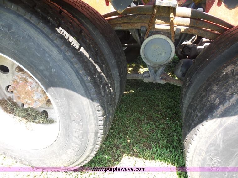 image for item K1708 1999 Volvo WG64 roll-off truck