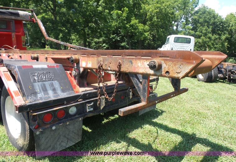 image for item K1708 1999 Volvo WG64 roll-off truck