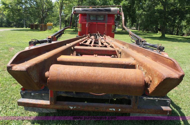 image for item K1708 1999 Volvo WG64 roll-off truck