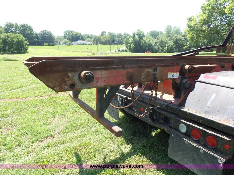 image for item K1708 1999 Volvo WG64 roll-off truck