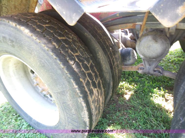 image for item K1708 1999 Volvo WG64 roll-off truck