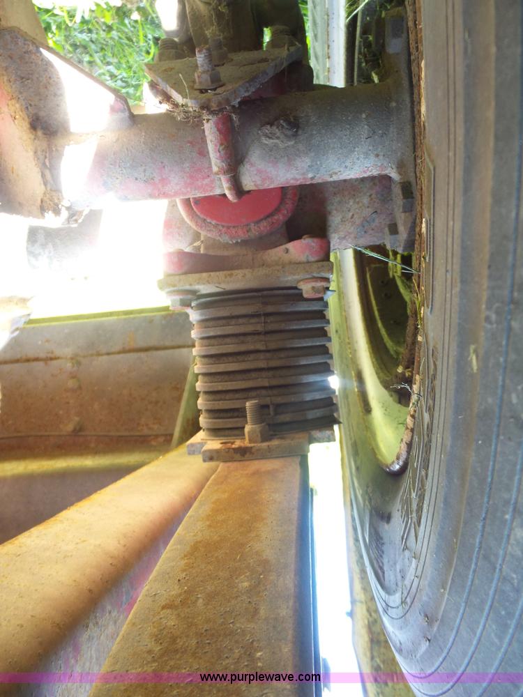 image for item K1708 1999 Volvo WG64 roll-off truck