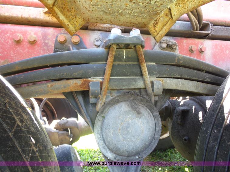 image for item K1708 1999 Volvo WG64 roll-off truck