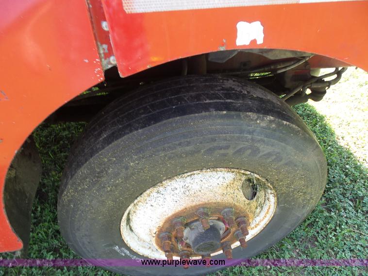 image for item K1708 1999 Volvo WG64 roll-off truck