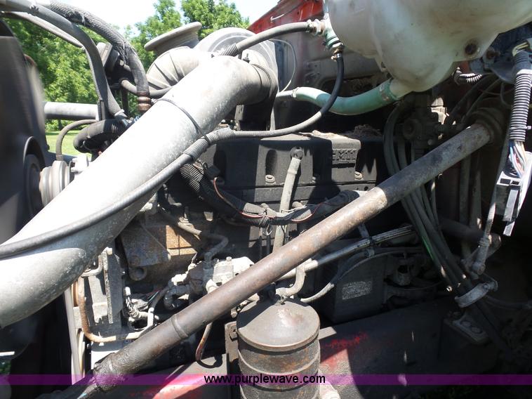 image for item K1708 1999 Volvo WG64 roll-off truck