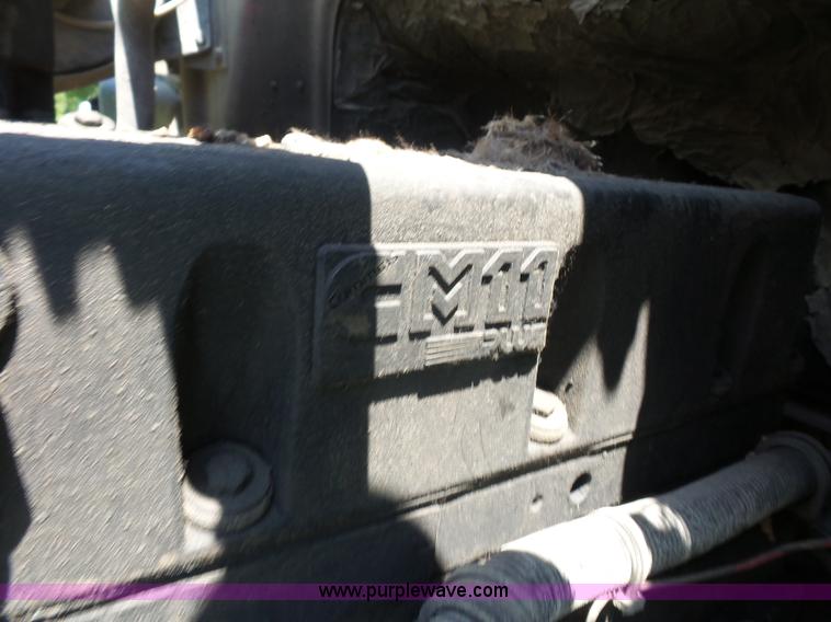 image for item K1708 1999 Volvo WG64 roll-off truck