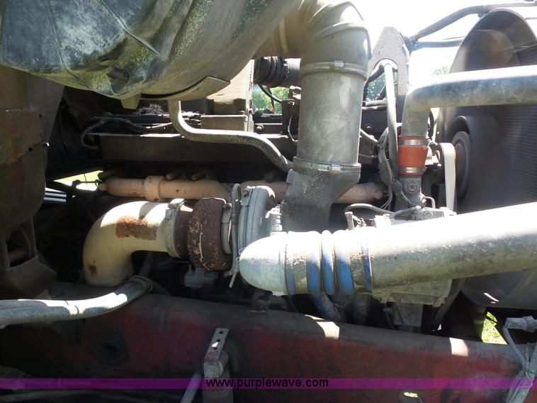 image for item K1708 1999 Volvo WG64 roll-off truck