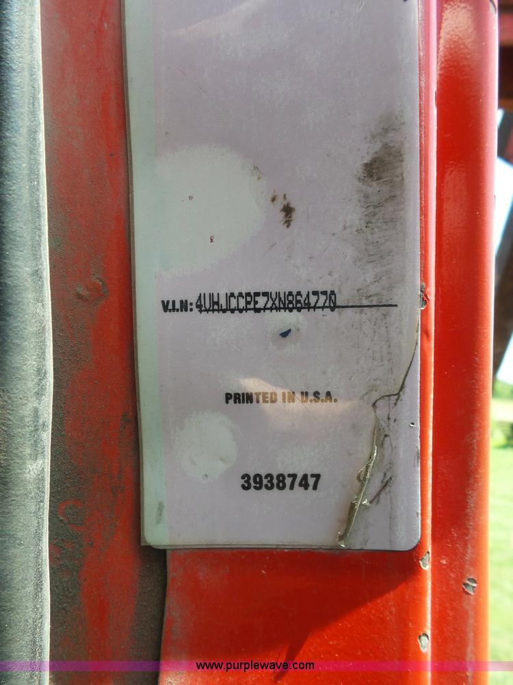 image for item K1708 1999 Volvo WG64 roll-off truck