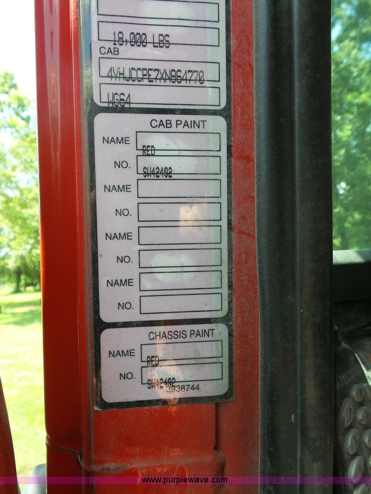 image for item K1708 1999 Volvo WG64 roll-off truck