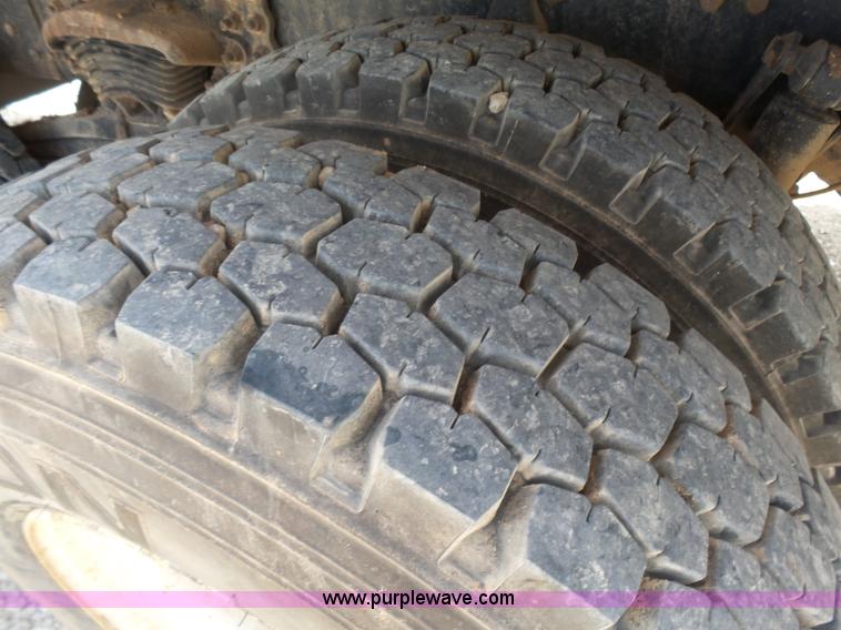 image for item K3175 2005 Sterling flatbed truck with knuckle boom