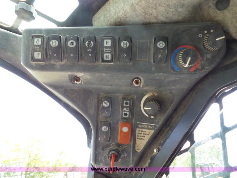 image for item L1579 2010 John Deere 333D skid steer