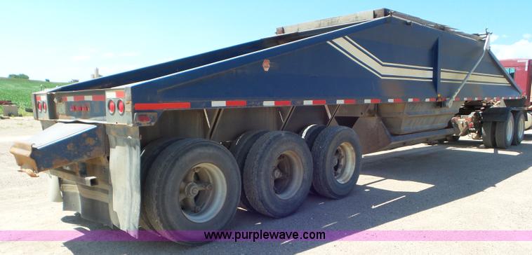 image for item L6856 1987 Midland bottom dump trailer