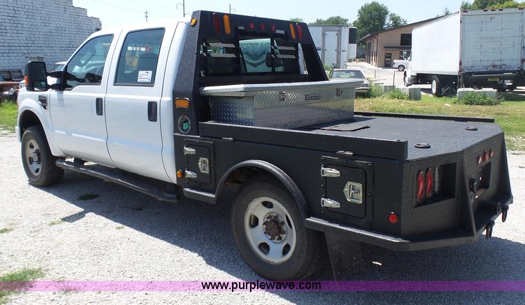 image for item L7112 2008 Ford F350 Super Duty Crew Cab flatbed pickup truck