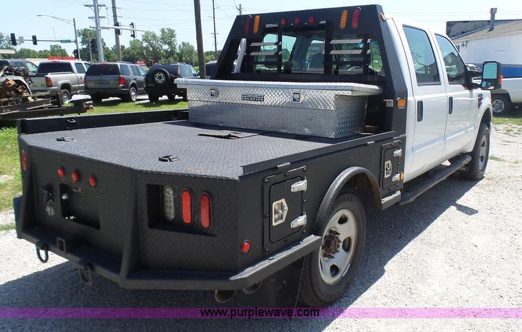 image for item L7112 2008 Ford F350 Super Duty Crew Cab flatbed pickup truck