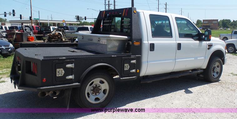 image for item L7112 2008 Ford F350 Super Duty Crew Cab flatbed pickup truck