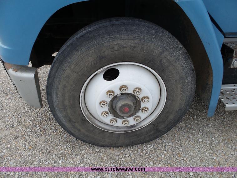 image for item K1169 1999 Freightliner FL70 fuel truck