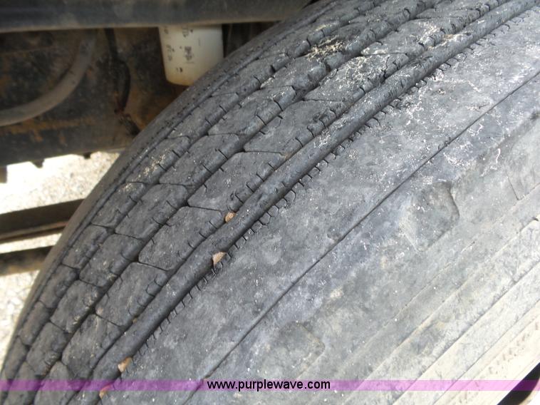 image for item K1169 1999 Freightliner FL70 fuel truck