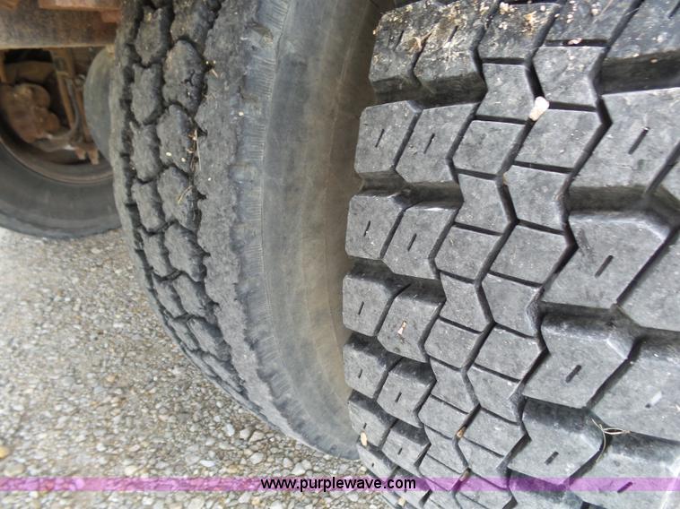 image for item K1169 1999 Freightliner FL70 fuel truck