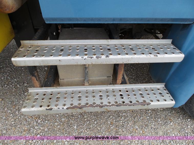 image for item K1169 1999 Freightliner FL70 fuel truck