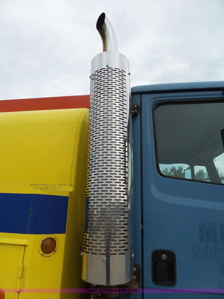 image for item K1169 1999 Freightliner FL70 fuel truck