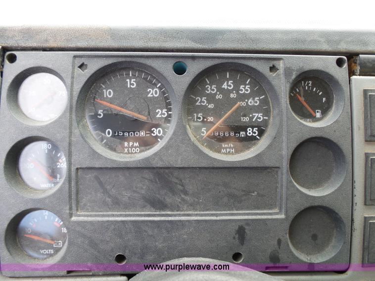 image for item K1169 1999 Freightliner FL70 fuel truck