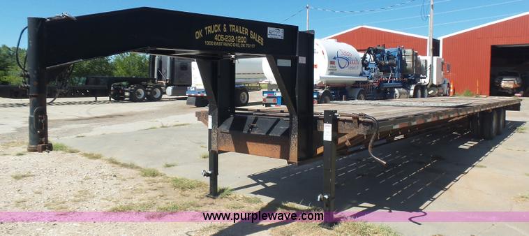 image for item L5974 2009 RMST flatbed trailer