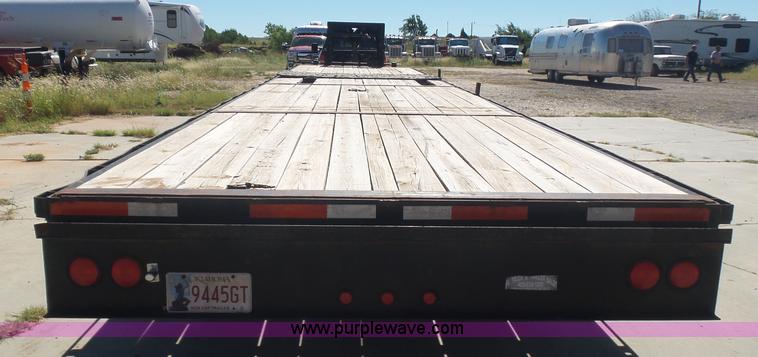 image for item L5974 2009 RMST flatbed trailer